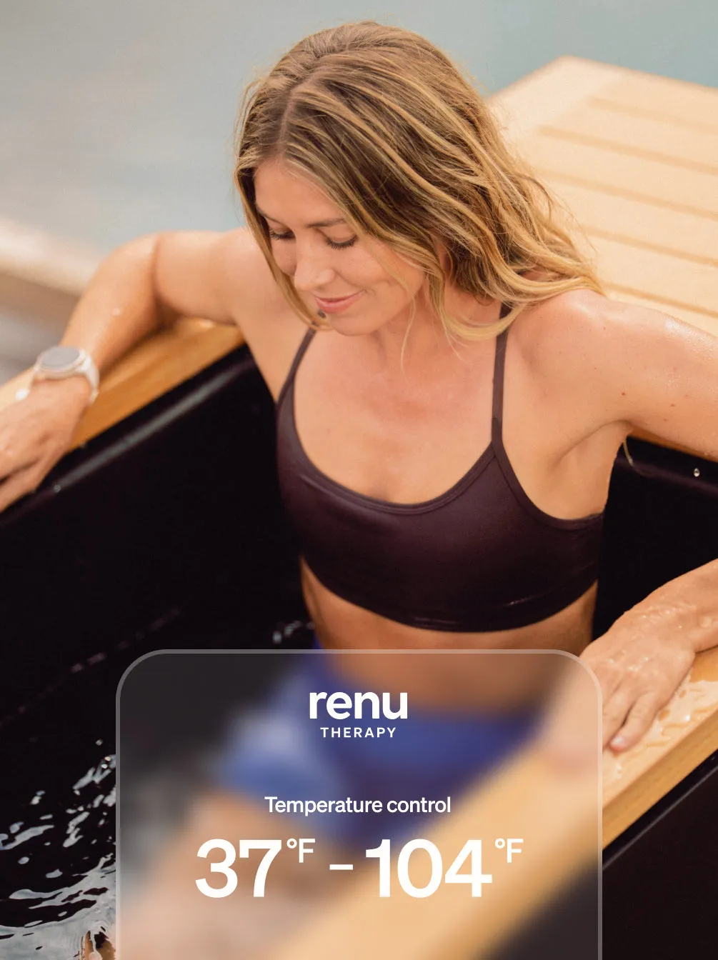 Woman in the plunge beside a display reading 37°F to 104°F