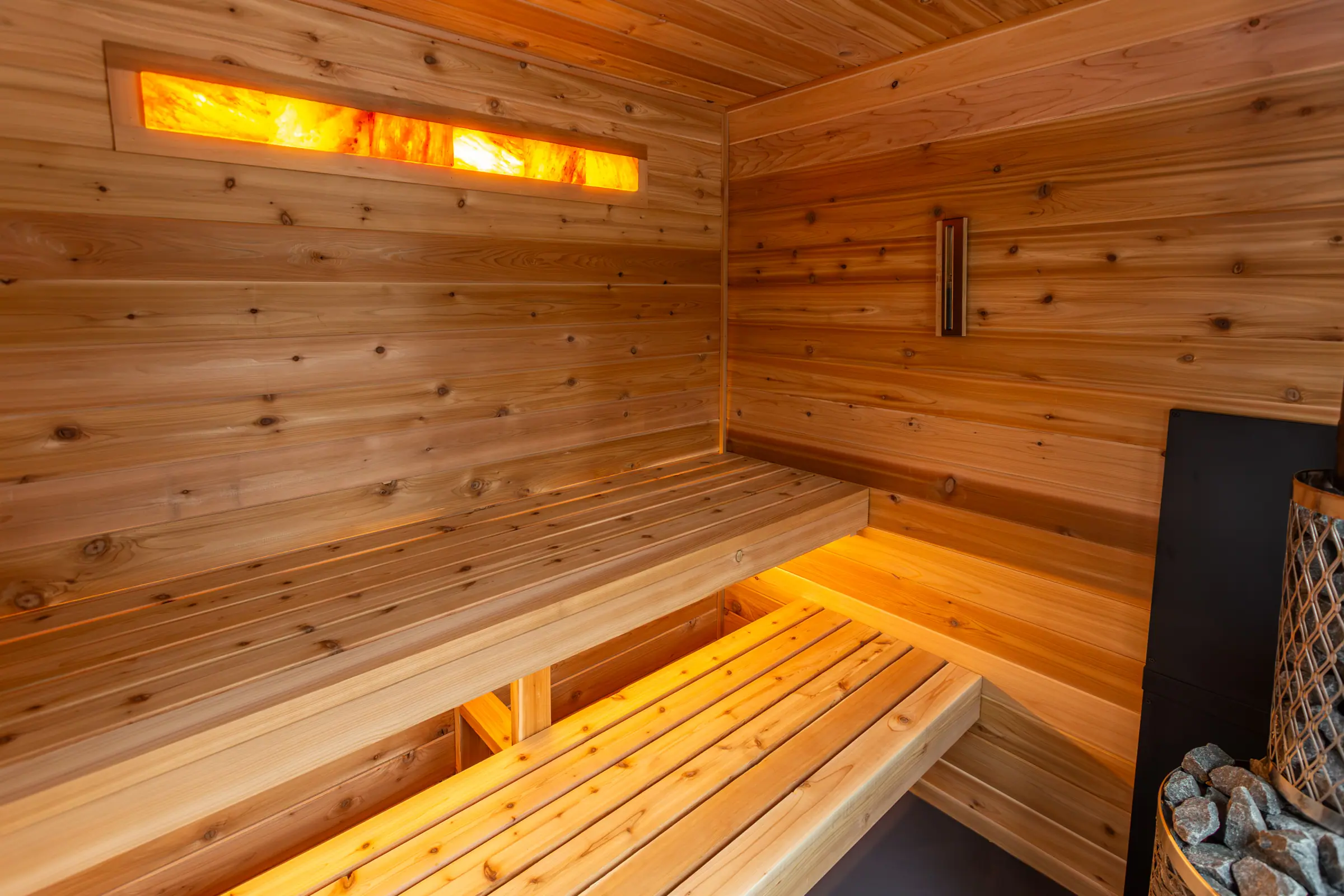 Cedar benches under a backlit salt panel