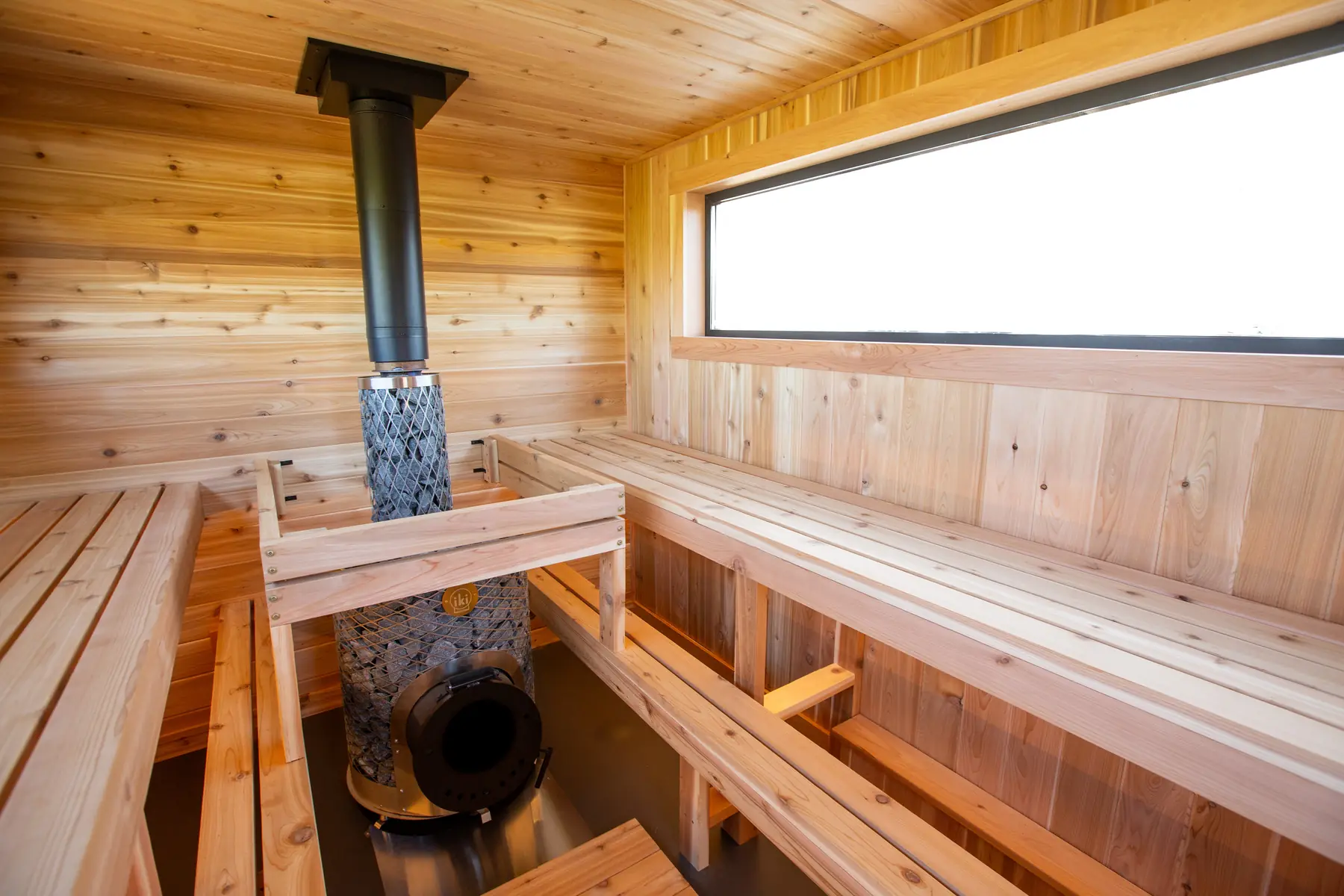 Long window above the cedar benches inside the Mobile 10