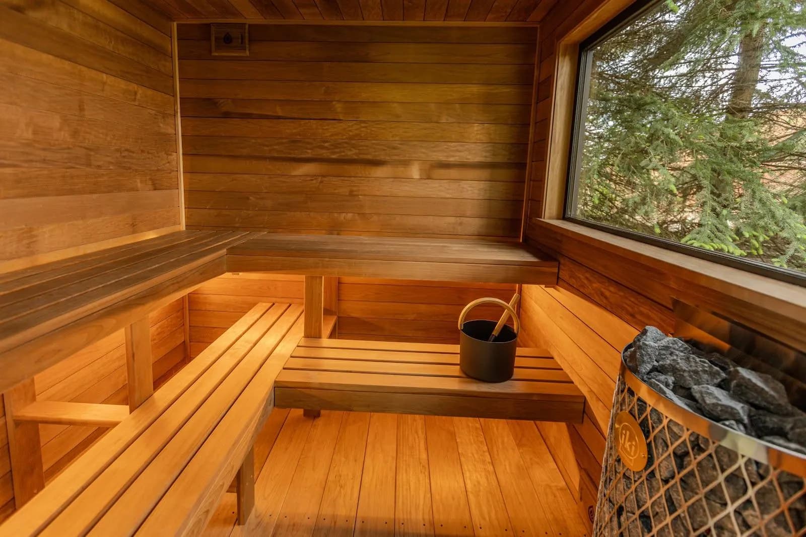 L-shaped cedar benches with warm under-bench lighting