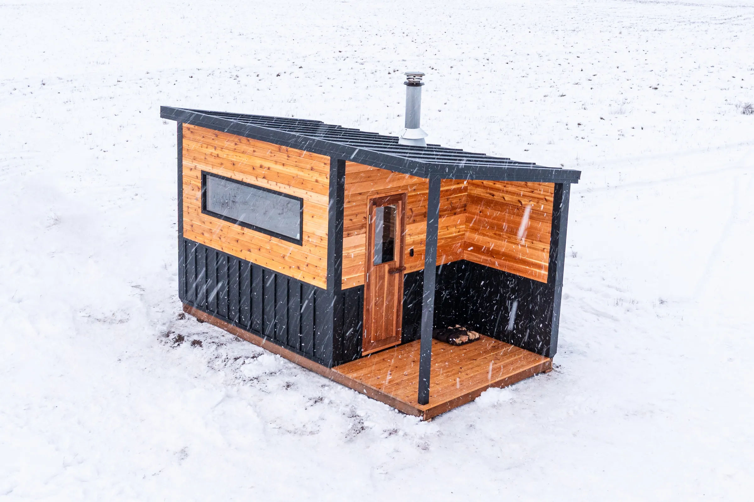 Aerial view of the Model N with its covered porch in fresh snow