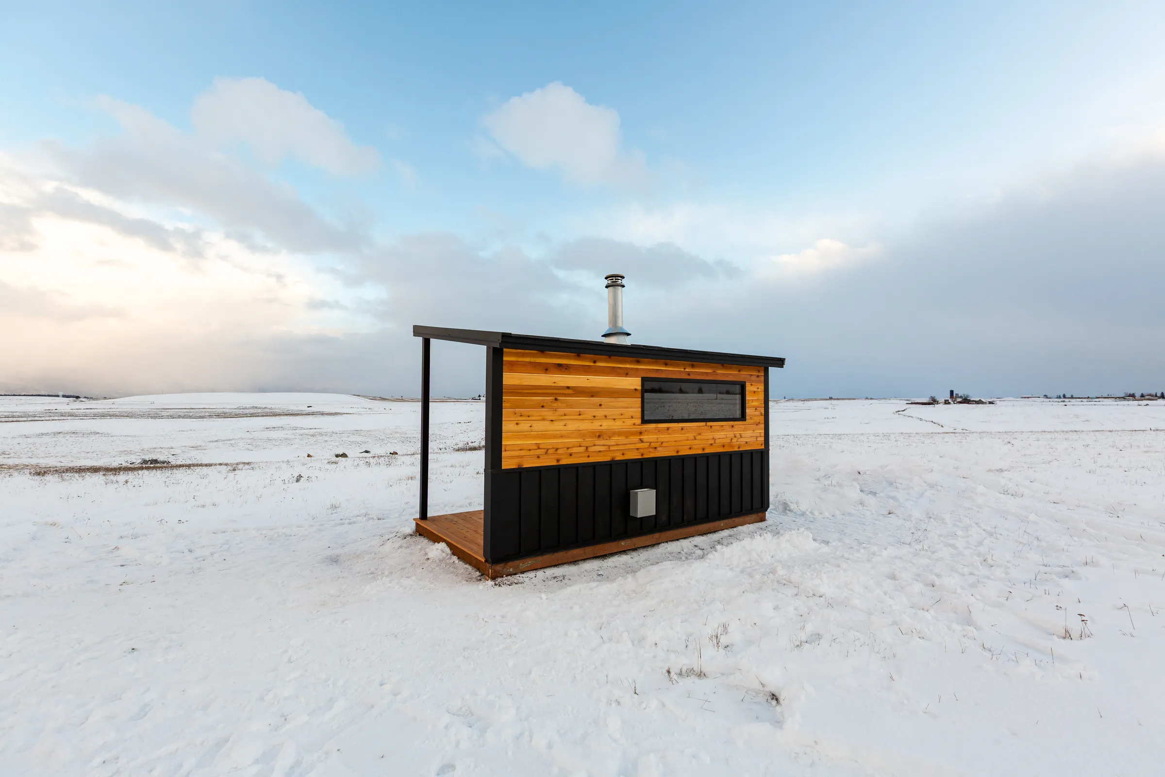 Model N alone on a wide snowfield under a winter sky