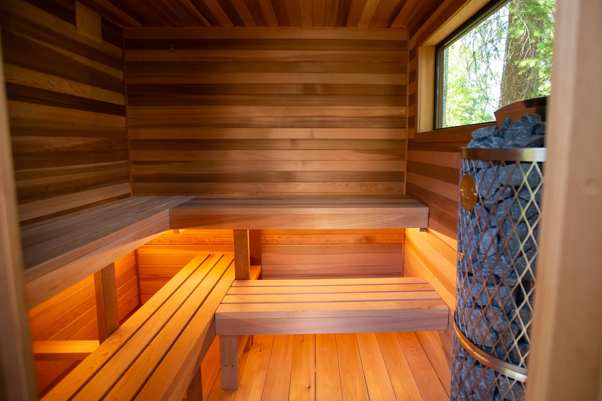 Cedar sauna benches with warm under-bench lighting