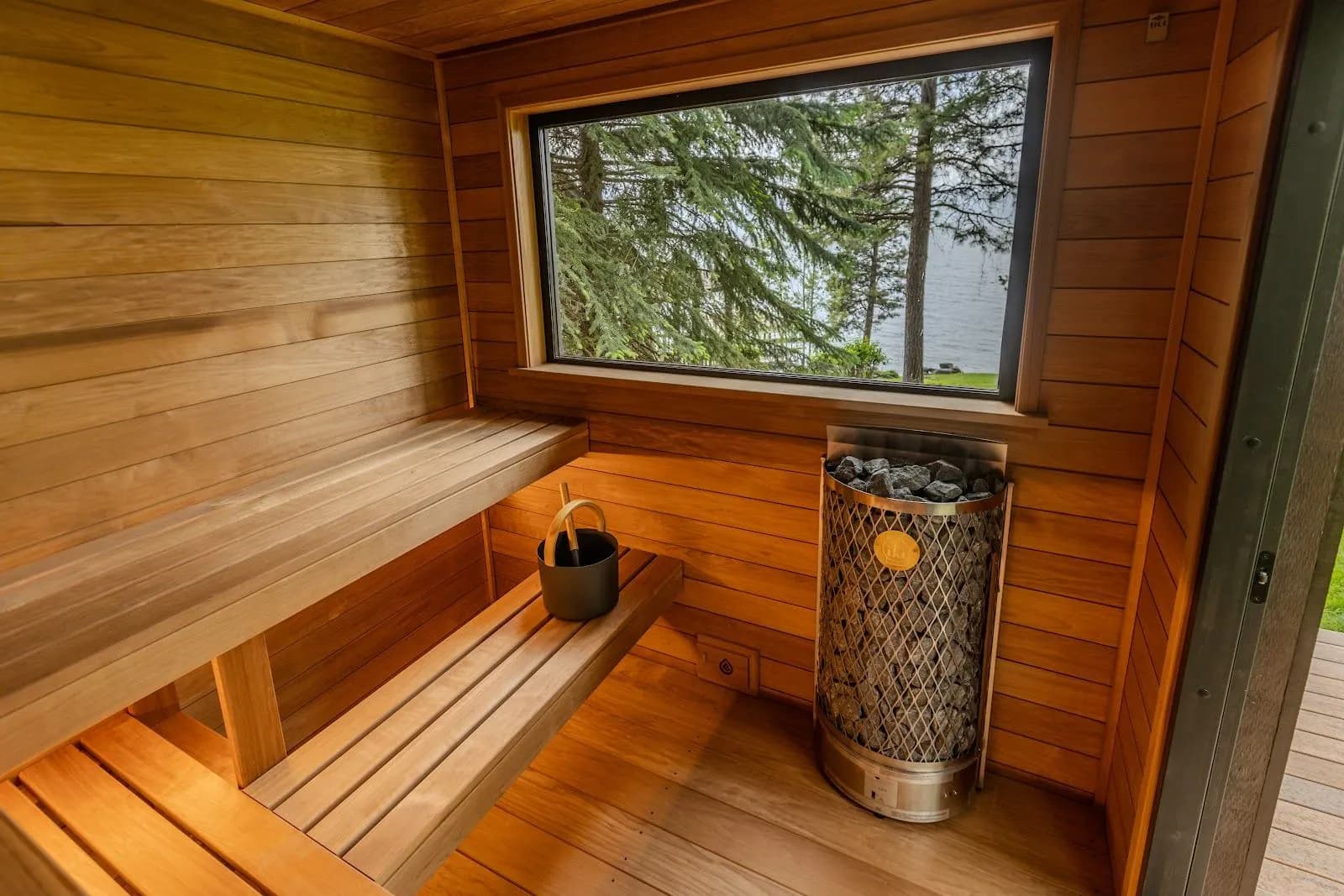 Picture window above the upper bench with the Iki stove in the corner